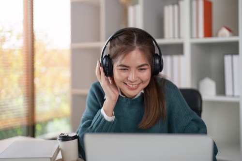 Learner studying with headphones